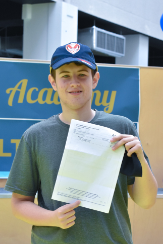 Picture of our student Ben with his results