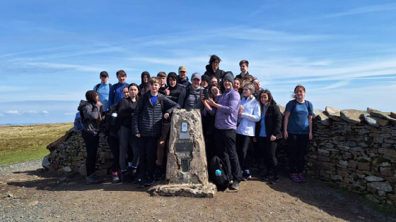 Picture of our students at the top of Whernside Mountain