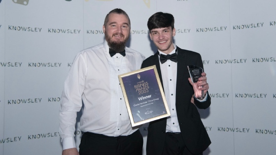 Apprentice of the year winner, Charlie, with his employer and the Knowsley Business Awards 2023.
