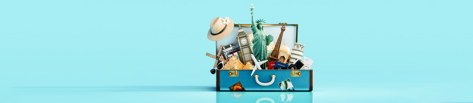 Image of a suitcase with travel items bursting out